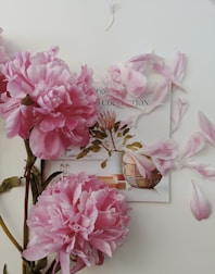 An artistic arrangement of peony-themed botanical sketches and poetry pages.