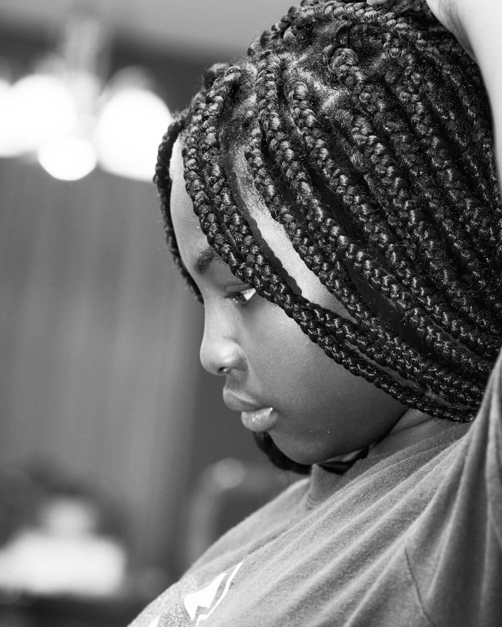 grayscale photography of woman in crew-neck shirt