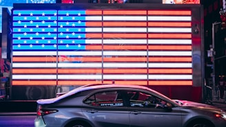 shallow focus photo of gray sedan