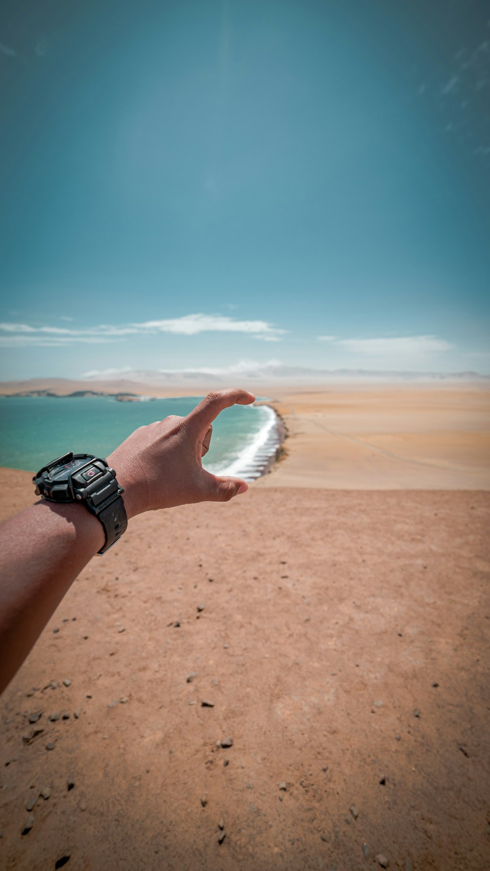 force perspective photography of person measuring shore