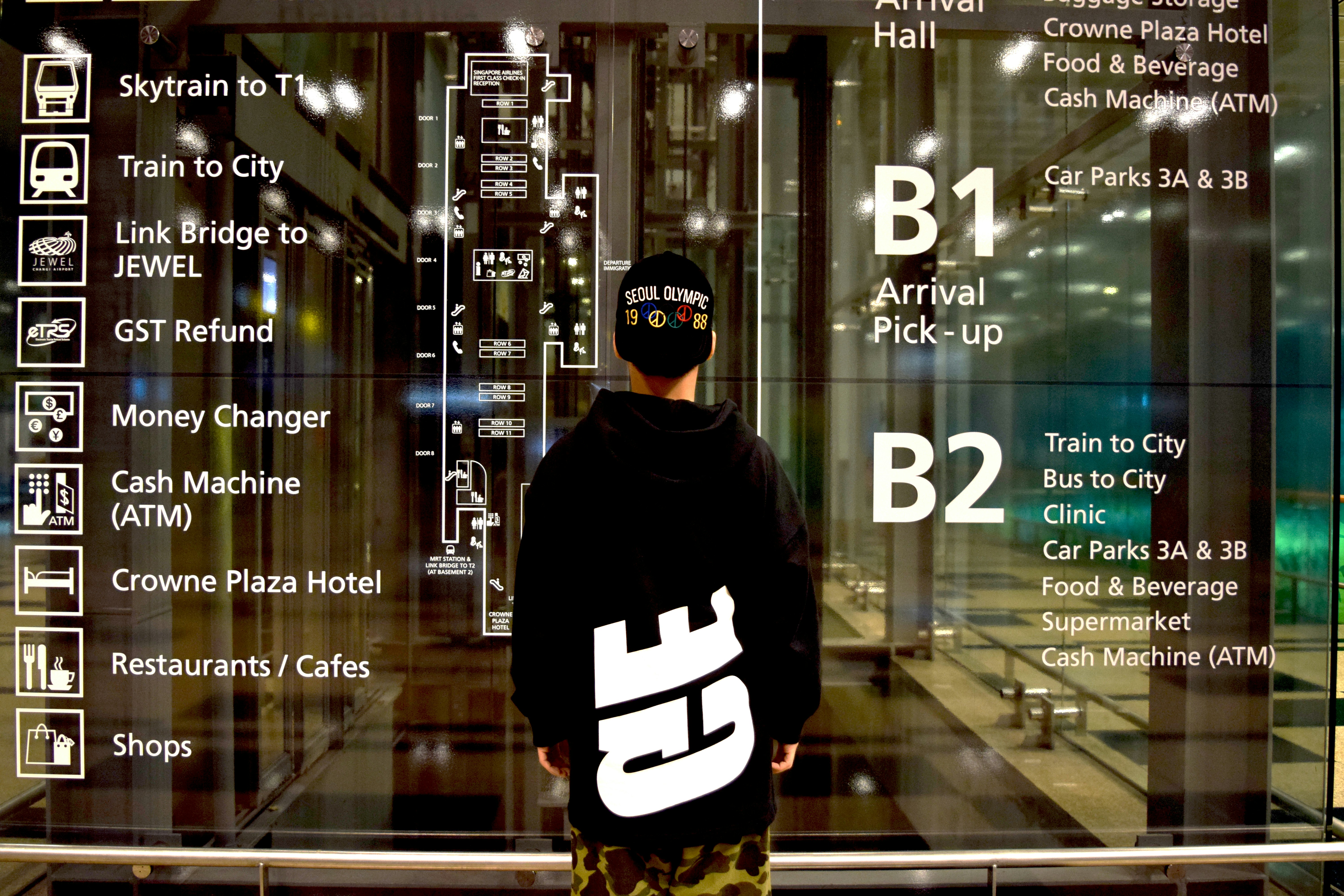 person standing in front of glass wall