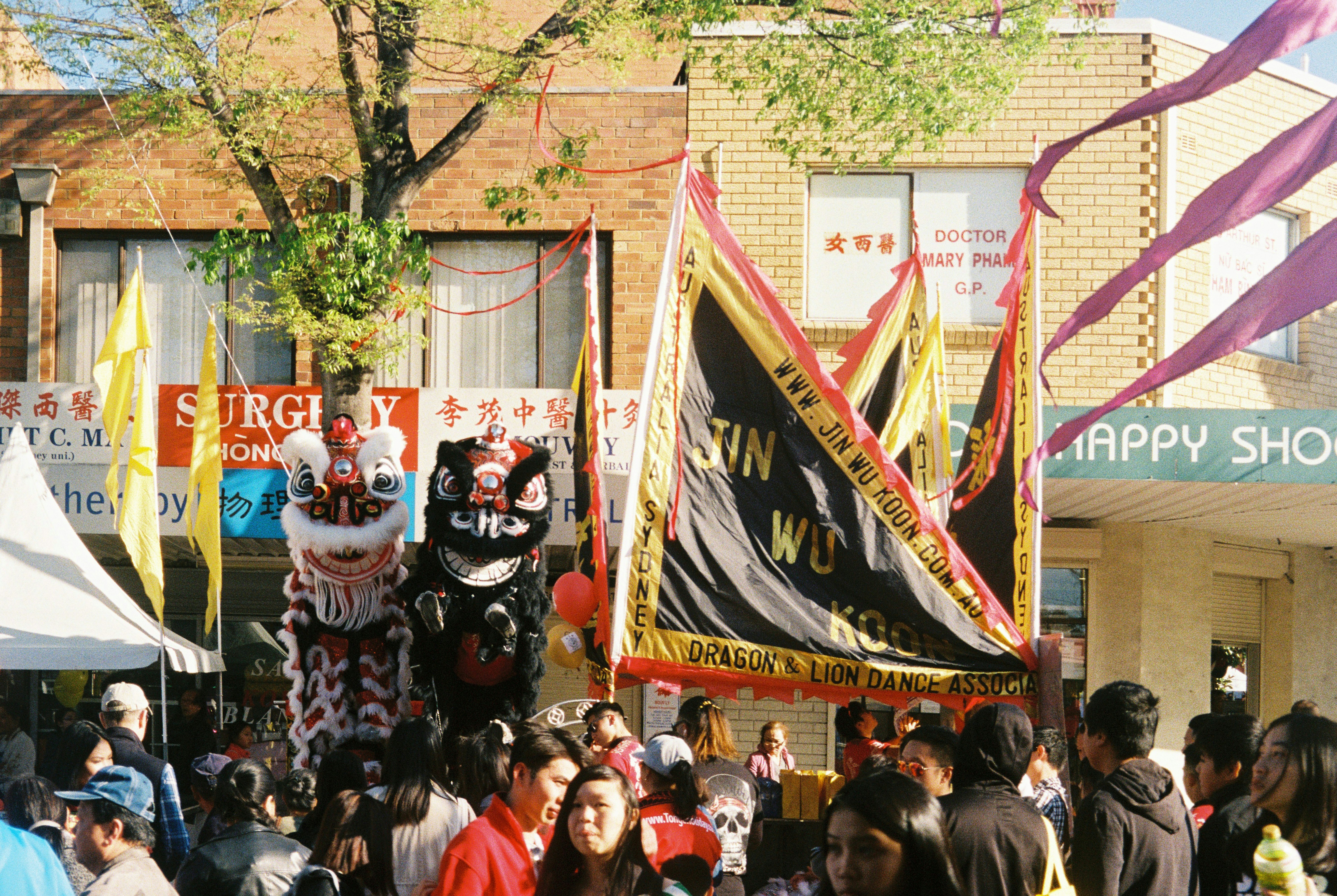 people watching parade near building, Cabramatta Moon Festival.