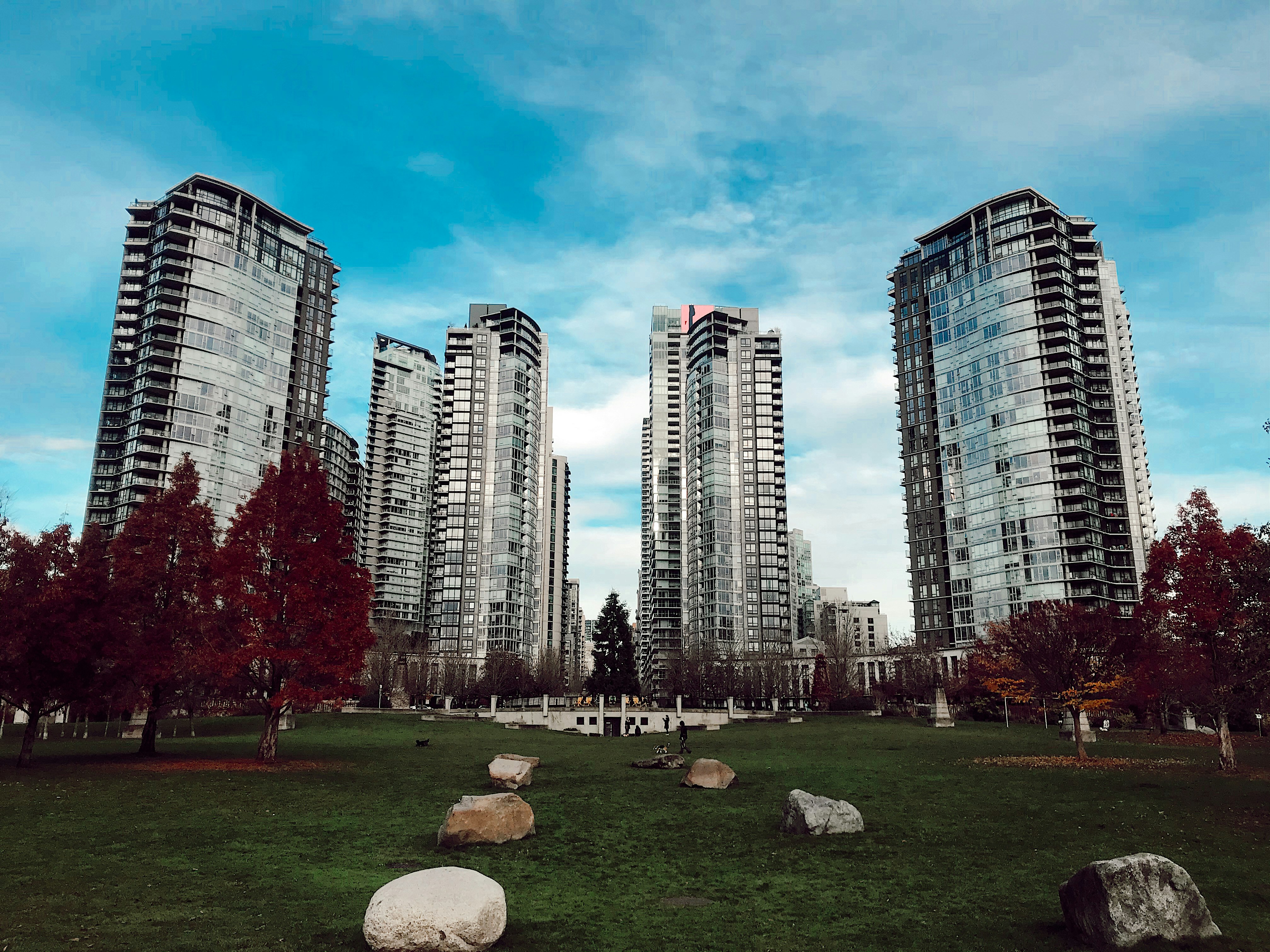 gray city buildings under cloudy sky