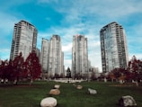 gray city buildings under cloudy sky