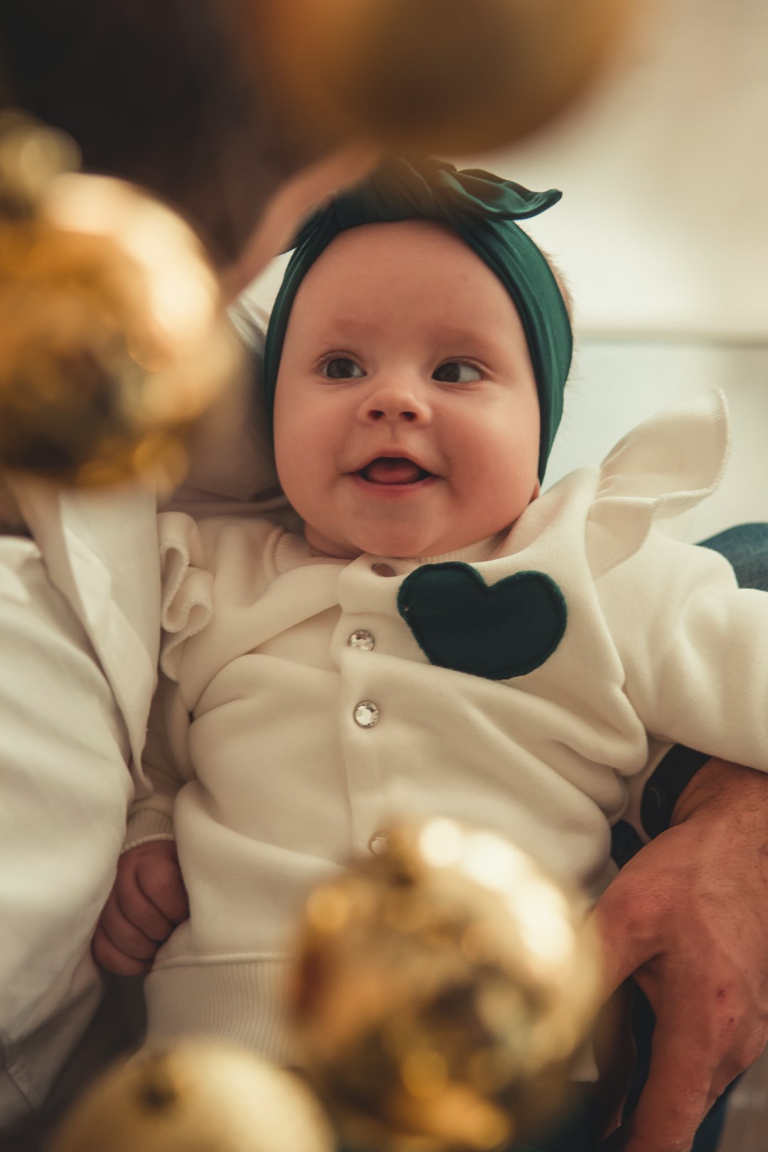 baby wearing white button-up long-sleeved shirt