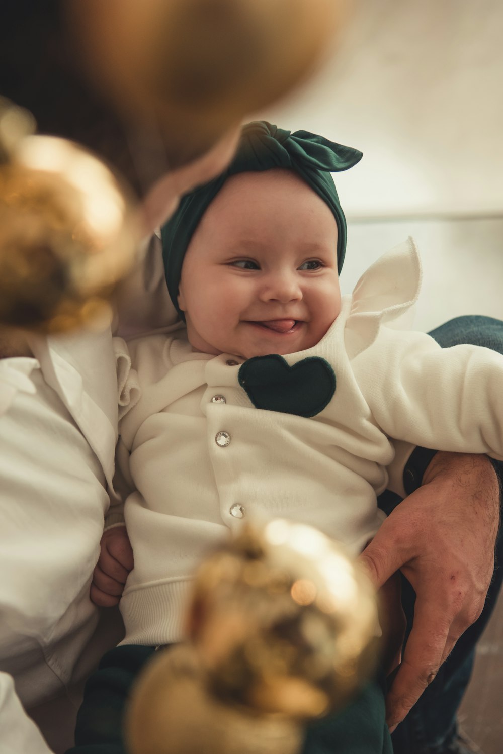 shallow focus photo of toddler in white long-sleeved shirt