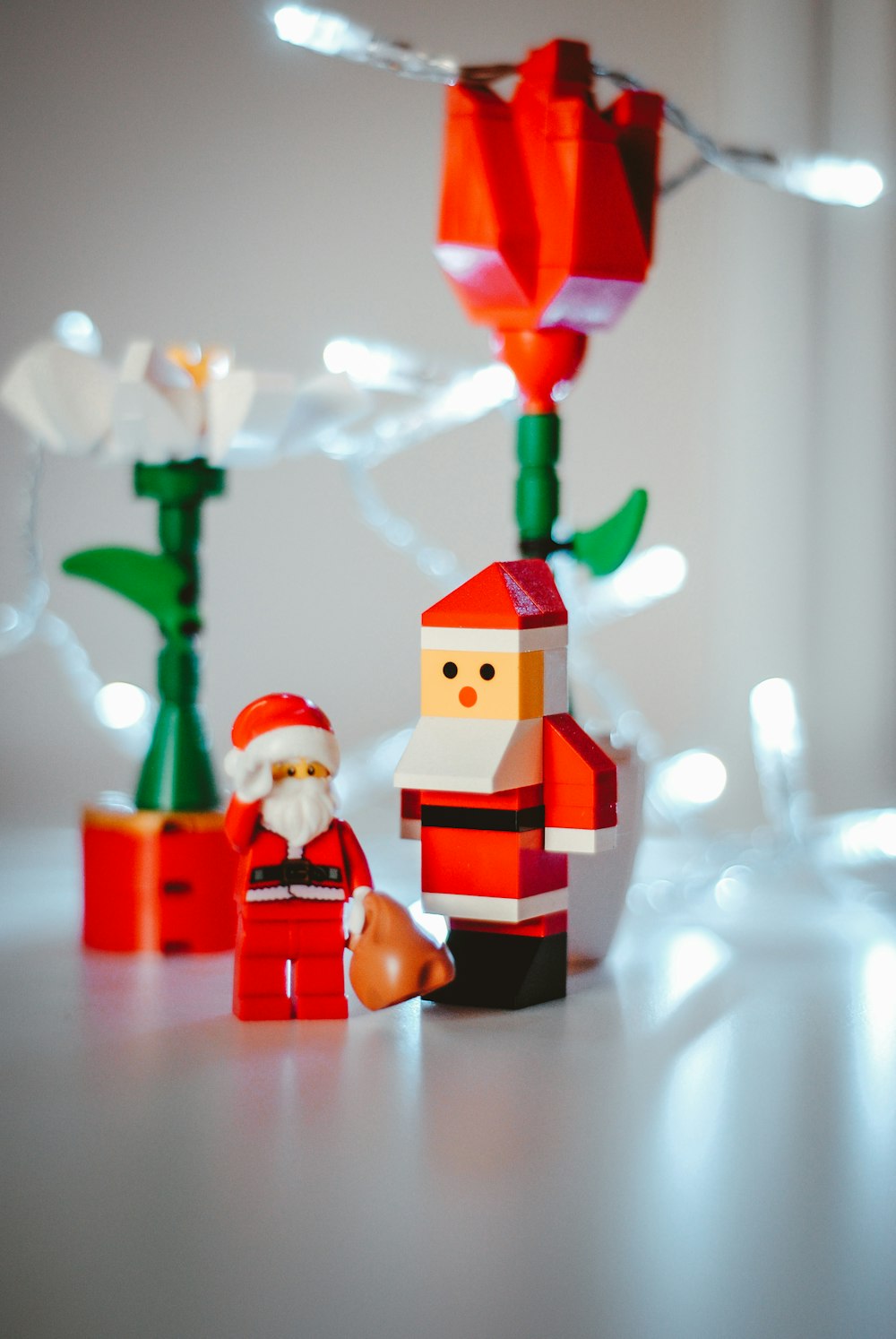 two Santa Claus figurines