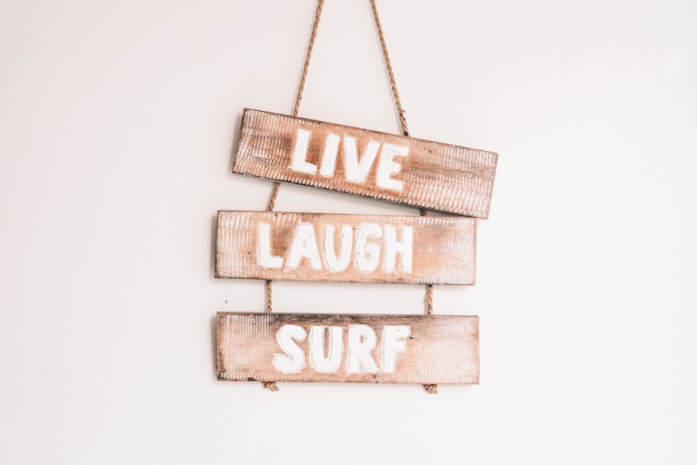 brown wooden live, laugh, love hanging decor