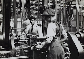 grayscale photo of man doing mechanical work