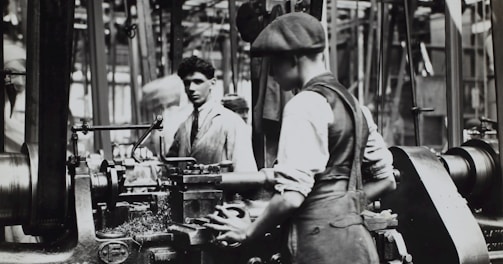 grayscale photo of man doing mechanical work