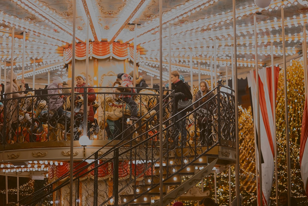 people riding carousel