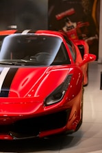 selective focus photography of red car