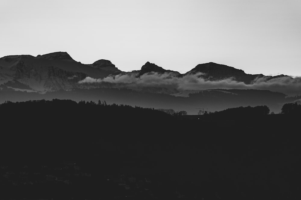 grayscale photography of mountain ranges