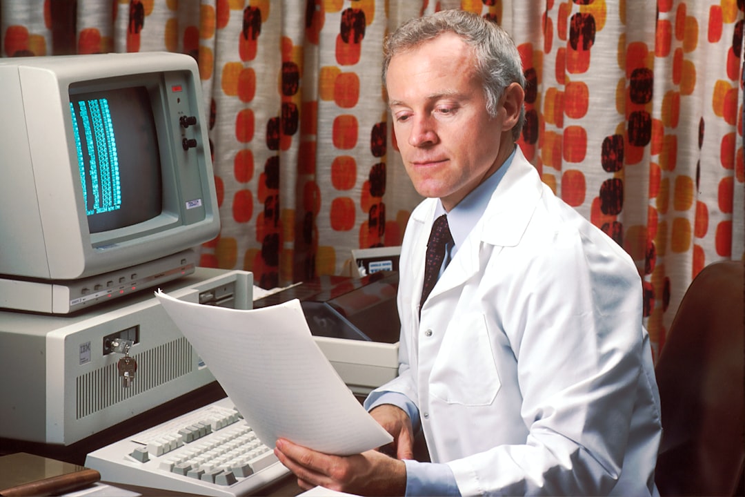 Doctor sitting at his office desk accessing PDQ on his computer in the 1980s. The Physicians Data Query was designed by the National Cancer Institute to help physicians obtain information about the most up-to-date protocols, physicians, and clinics treating cancer patients.
1987