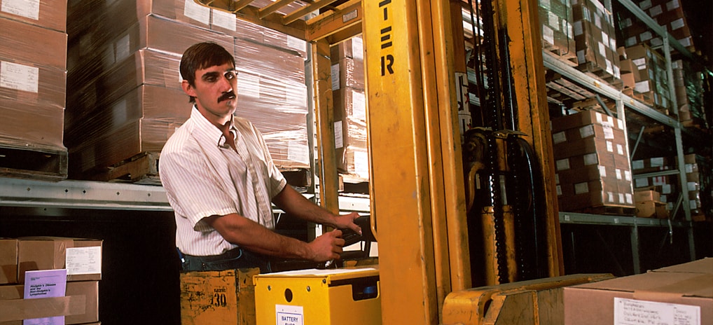 yellow driving forklift