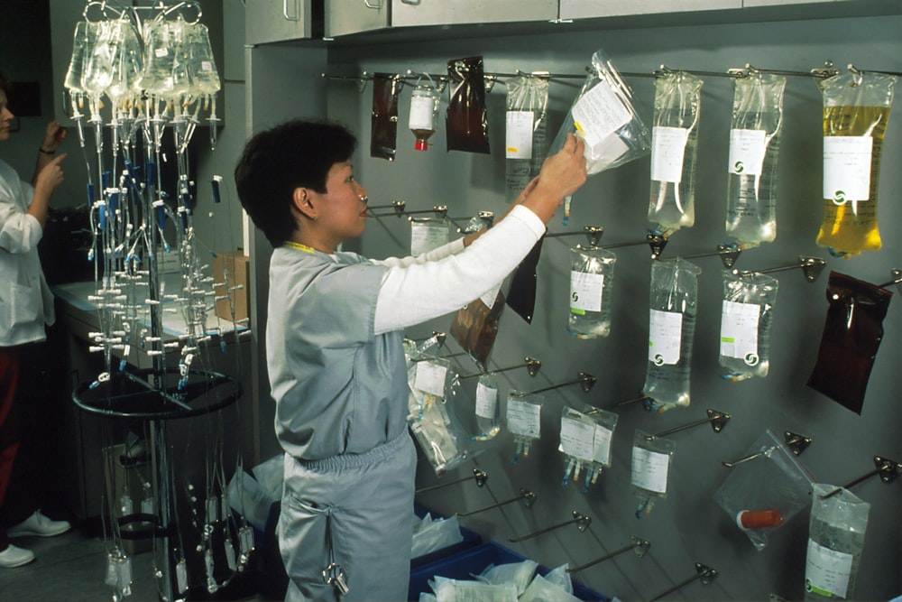 woman arranging IV bags