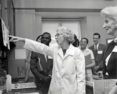 A group of diverse researchers collaborating in a lab setting.