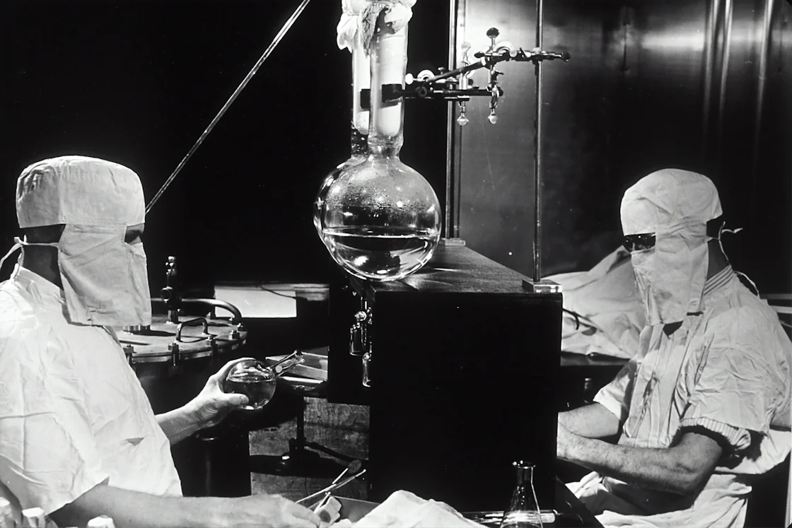 Grayscale photo of people inside laboratory