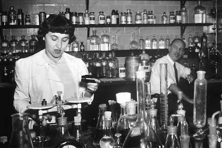 A scientist measuring chemical components in a laboratory setting.