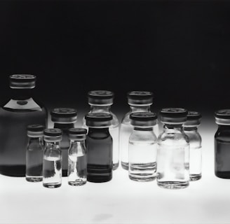 grayscale photo of glass tubes