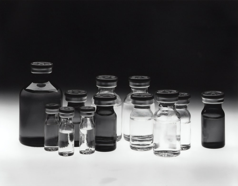 grayscale photo of glass tubes