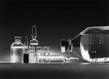 Close-up of high-quality pharmaceutical vials arranged neatly on a sterile surface.