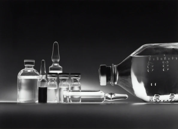Close-up of laboratory glassware neatly arranged on a shelf, showcasing precision and quality.