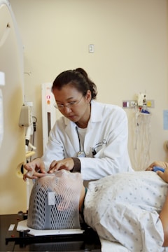 doctor standing beside man inside room