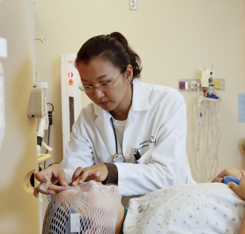 doctor standing beside man inside room