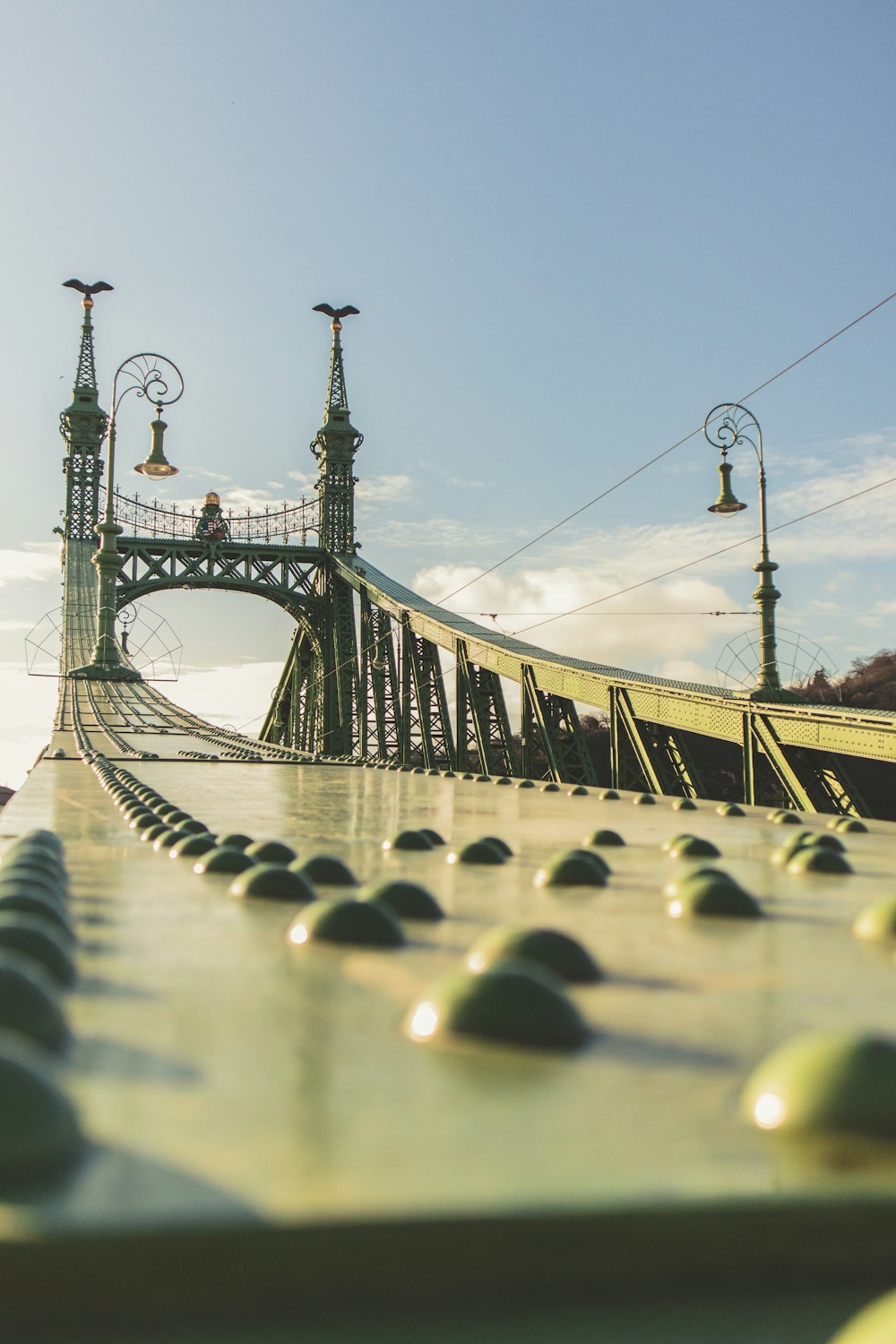 grey metal bridge during cloudy day