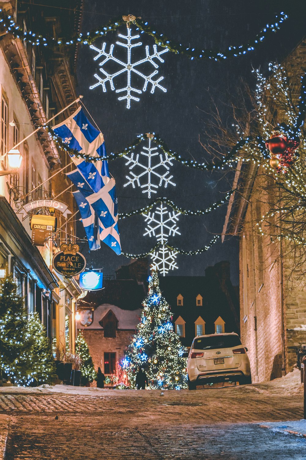 brown concrete buildings and Christmas tree