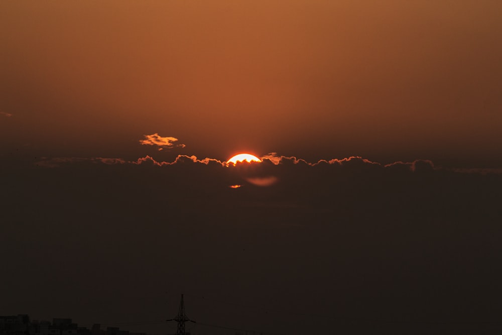 sun behind clouds