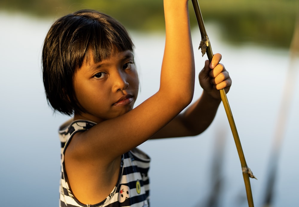 girl holding green vine