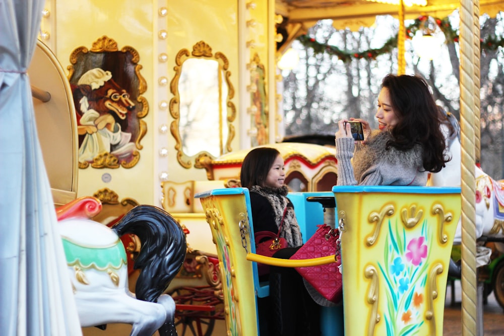 woman sitting on carousell