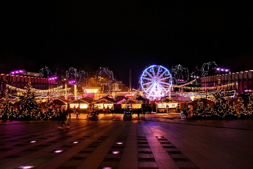 lighted Ferris wheel during nighttime