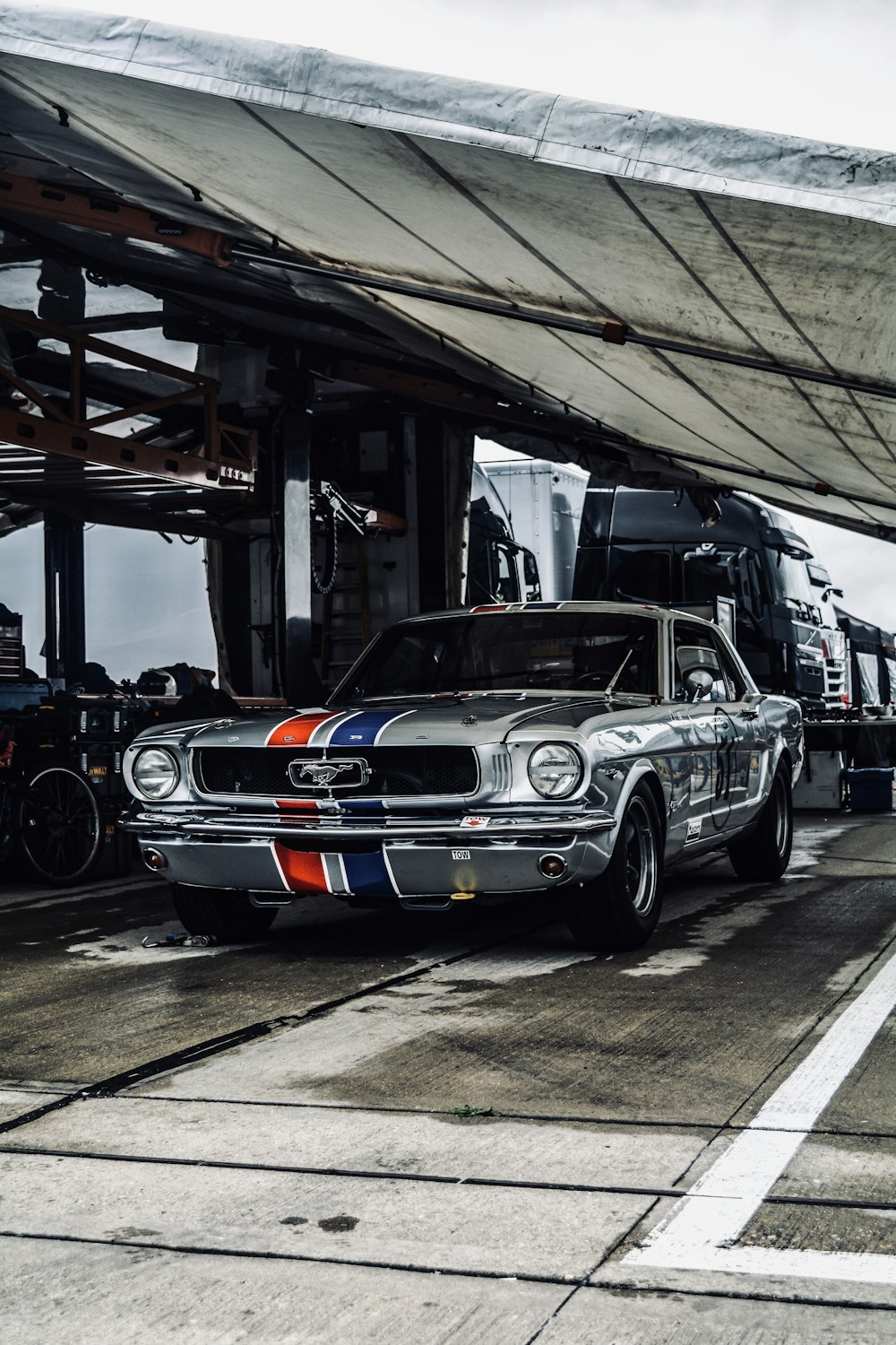 shallow focus photo of gray Ford Mustang