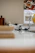 A cheerful kitchen countertop with vibrant vivanido utensils neatly arranged next to a bowl of fresh fruit.