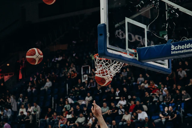A dynamic shot of BlazeHoop players in action on the court, with fans cheering in the background.