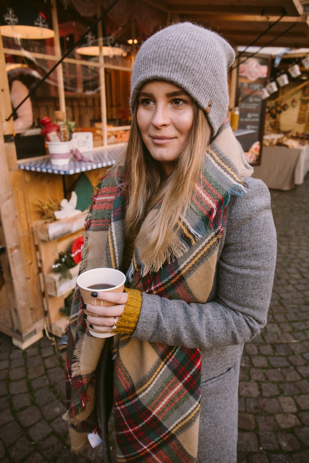 woman holding cup of coffee