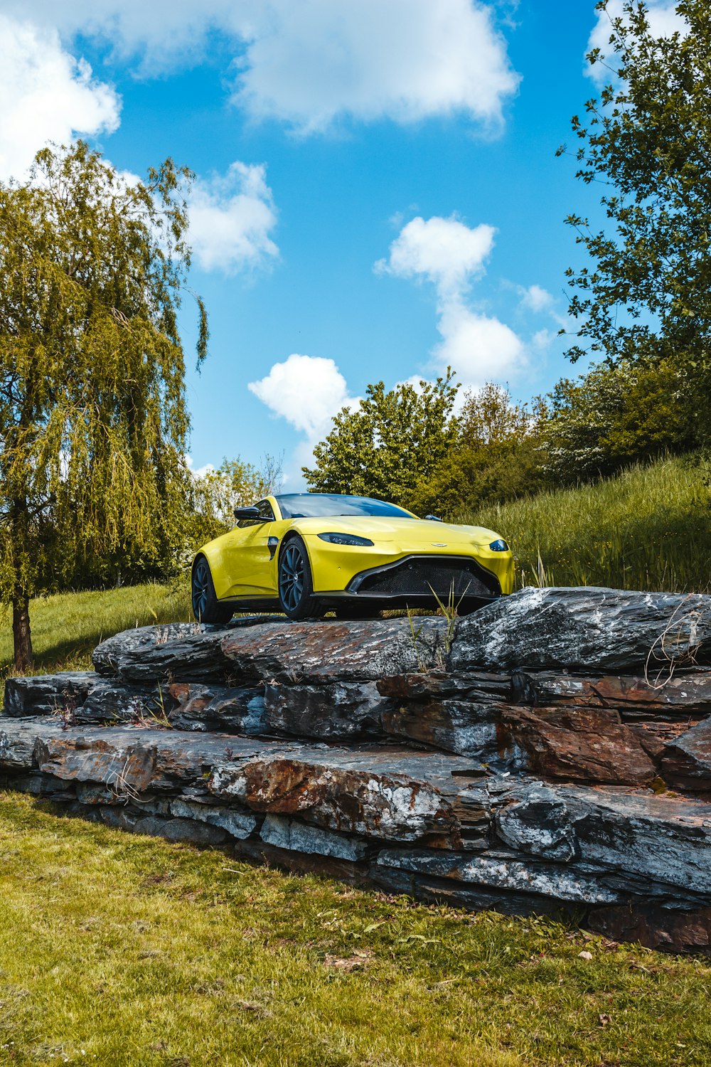 shallow focus photo of yellow coupe