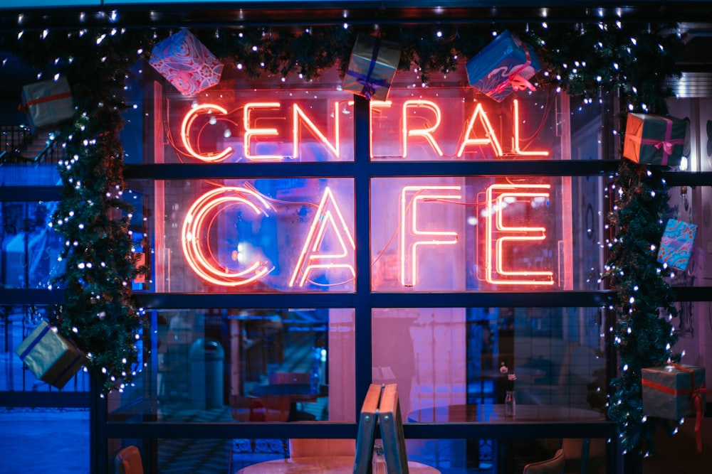 shallow focus photo of central cafe neon signage