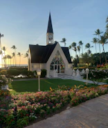 A serene sunrise over a quiet chapel, symbolizing new beginnings in faith