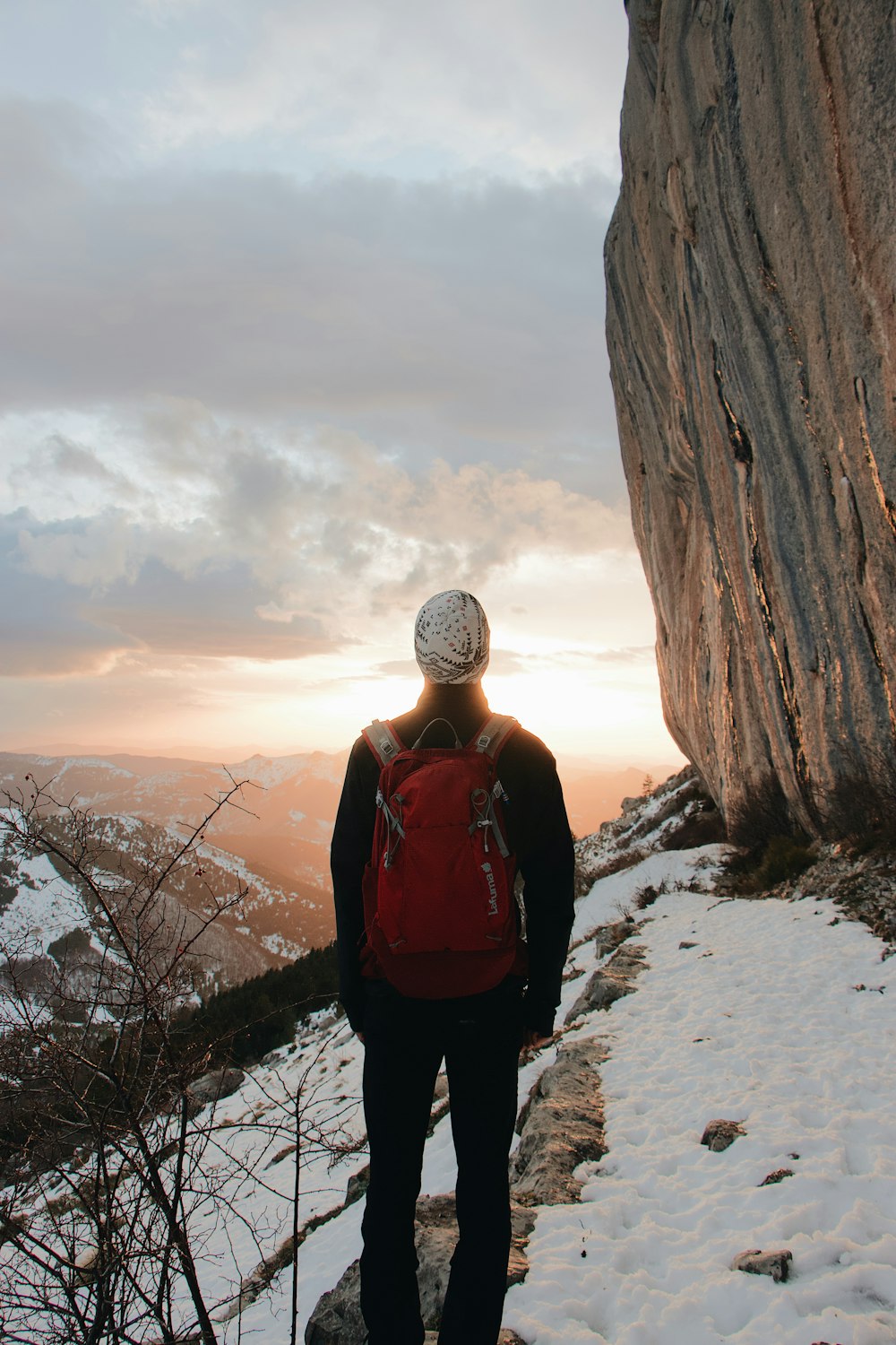 man wearing red backpack