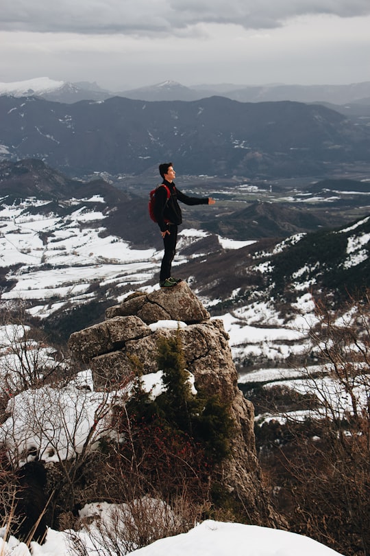 man standing on rock in Céüse France