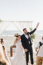 newly wed couple at shore during daytime