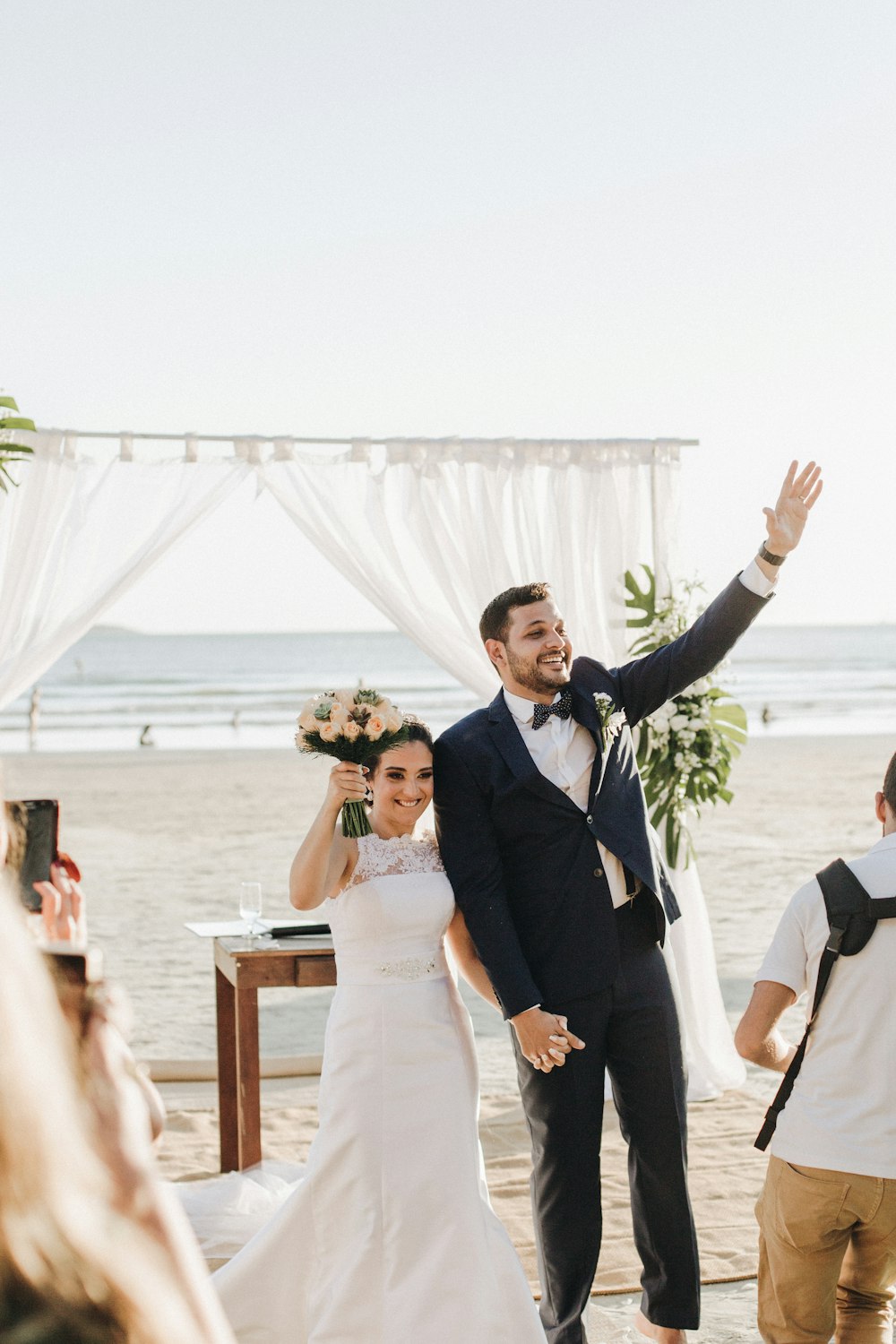 newly wed couple at shore during daytime