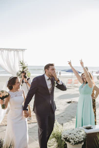 A joyful wedding ceremony taking place by the coast.