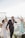 A joyful couple celebrating their wedding on a picturesque beach.