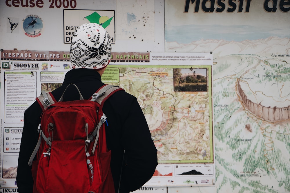 person wearing red backpack