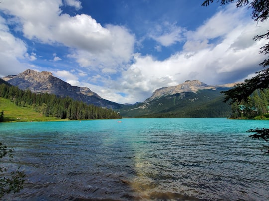 sea between mountain during cloudy sky in Yoho National Park Of Canada Canada